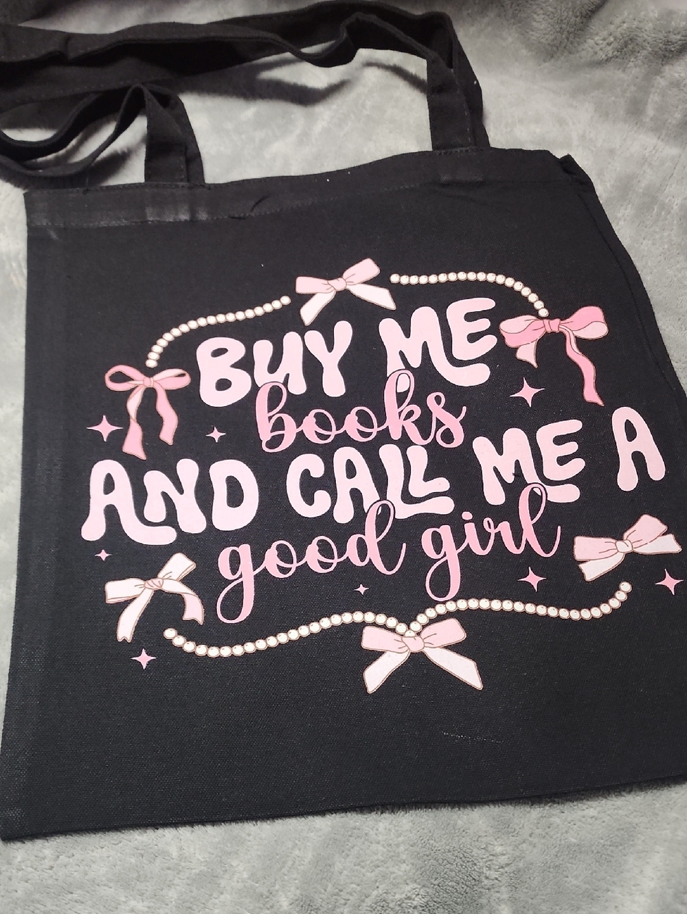 Black Tote Bag with Pink 'Buy Me Books' Graphic. 13x15